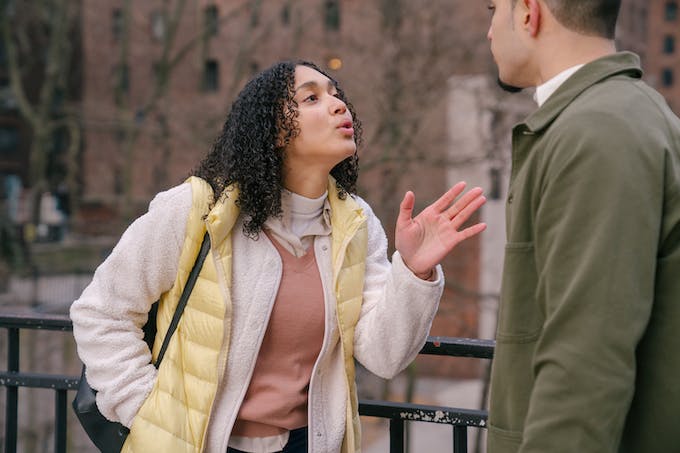 Photo by Budgeron Bach Young stylish Hispanic lady quarreling with crop boyfriend about infidelity