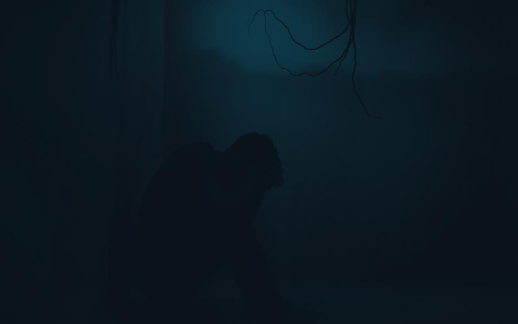 A dimly lit, gloomy room, cast in shades of gray and blue. In the foreground, a figure huddled in a corner, their face obscured by their hands, their body language conveying a sense of anguish and despair. Tendrils of shadow seem to reach out, enveloping the figure, symbolizing the emotional turmoil and psychological weight of betrayal trauma. The background is a hazy, blurred landscape, devoid of any distinct features, further emphasizing the isolation and disorientation experienced by the individual. Soft, diffused lighting casts a melancholic glow, creating an atmosphere of vulnerability and emotional fragility. The overall scene evokes a sense of profound sadness, inner turmoil, and the profound impact of betrayal on the human psyche.